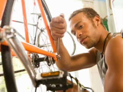 A man fixing a bike.