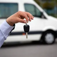 A hand holding car keys.