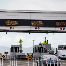 Toll lanes with information displays above them.