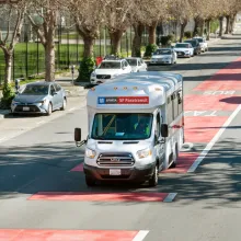 Paratransit vehicle in a city street