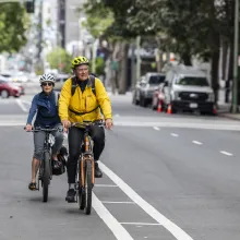 People biking in traffic