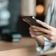 person looking at their cell phone