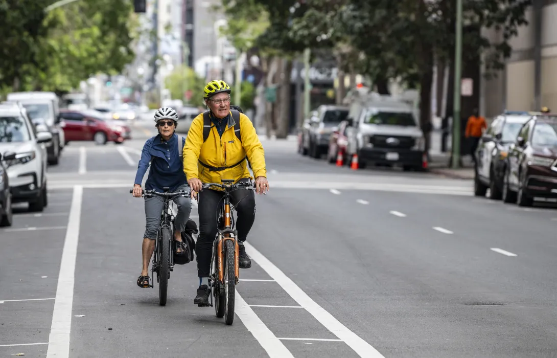 People biking in traffic