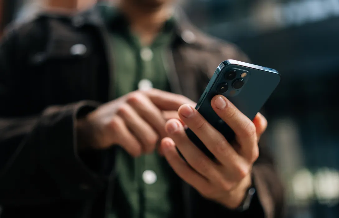 person looking at their cell phone